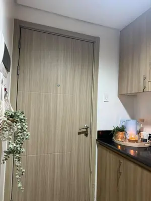 a wooden door in a kitchen with a counter at Near NAIA AIRPORT in Manila