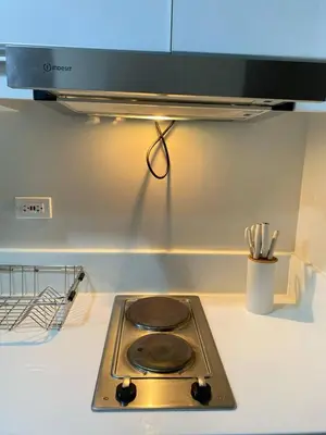 a stove top on a counter in a kitchen at Air Residences in Manila