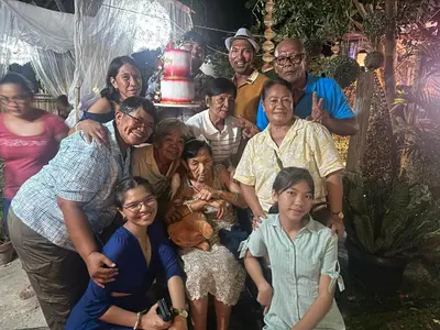 a group of people posing for a picture at TravelersChoiceCondominium in Manila