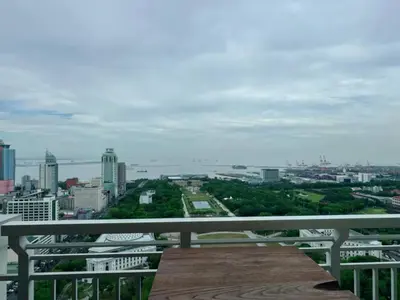 a view of a city from a balcony at Torre De Manila in Manila