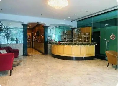 a lobby with a bar in a building at Seaview unit in Manila
