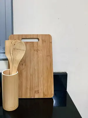 a wooden cutting board with a wooden spoon in a cup at Budget City View w Pool Access in BGC Taguig City in Manila