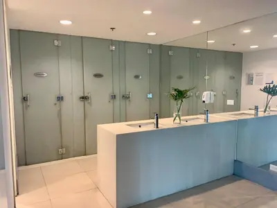 a bathroom with four lockers and a large mirror at Budget City View w Pool Access in BGC Taguig City in Manila