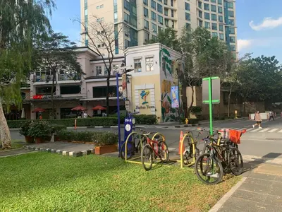 a group of bikes parked on the grass near a street at Budget City View w Pool Access in BGC Taguig City in Manila