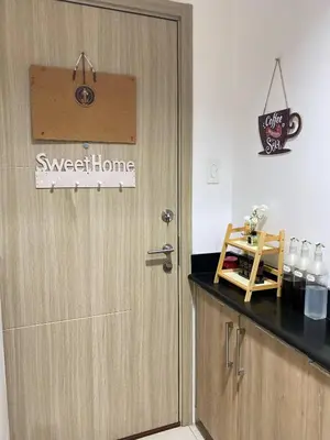 a door in a kitchen with a sign on it at Blytheo Urban Staycation by Jonathan in Manila