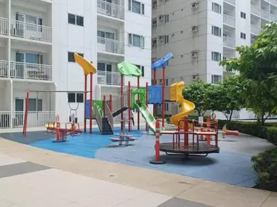 a playground in front of a building at Blytheo Urban Staycation by Jonathan in Manila