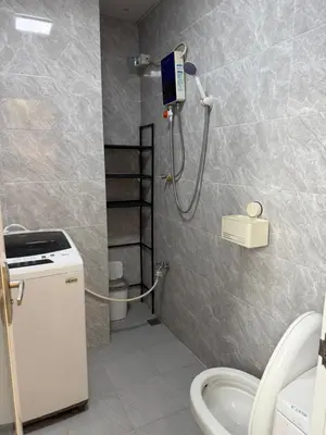 a bathroom with a shower and a toilet at JCAL Building Next to Manila Aiports Okada, Solaire MOA in Manila