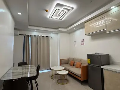 a living room with a couch and a table at JCAL Building Next to Manila Aiports Okada, Solaire MOA in Manila