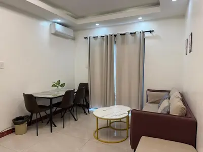 a living room with a couch and a table at JCAL Building Next to Manila Aiports Okada, Solaire MOA in Manila