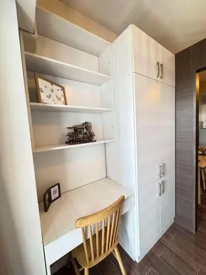 a room with a desk and a wooden chair at Comfortable & Peaceful for You #4806 in Manila
