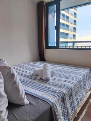 a bedroom with a bed with towels on it at Comfortable & Peaceful for You #4806 in Manila
