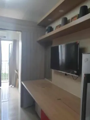 a kitchen with a flat screen tv on the wall at Shore 2 tower 2 in Manila
