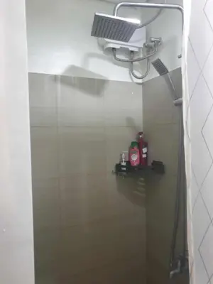 a bathroom with a shower with a shower head at Shore 2 tower 2 in Manila