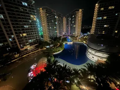 an aerial view of a city at night at Apple Paris Azure Staycation in Manila