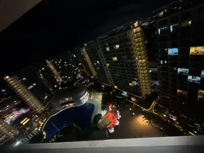 an aerial view of a city at night at Apple Paris Azure Staycation in Manila