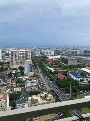 an aerial view of a city with buildings and traffic at FX Property 3926 in Manila