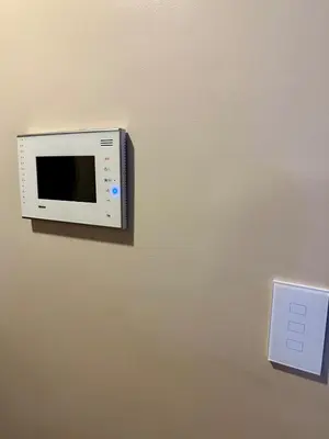 a microwave hanging on a wall with a lightswitch at Awesome Sunset View in Venice Mall Suite with PS5 30th edition, Walk to Everything, 5 mins away to BGC, DisneyPlus, Prime Video, HBO Max in Manila