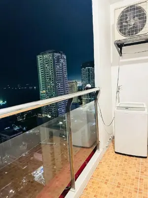 a balcony with a view of a city skyline at 1 Bedroom Seaview Room Korean Town heart of malate in Manila
