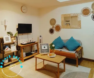 a living room with a couch and a table at SM Bicutan Miami in Manila