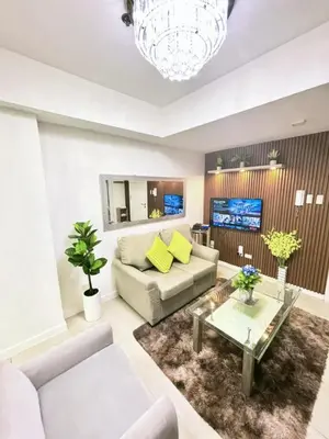 a living room with a couch and a table at SM Bicutan Miami in Manila
