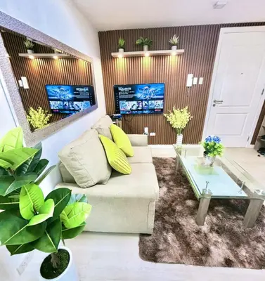 a living room with a couch and a table at SM Bicutan Miami in Manila