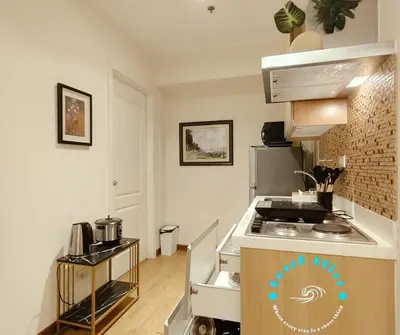 a kitchen with a stove and a counter top at SM Bicutan Miami in Manila