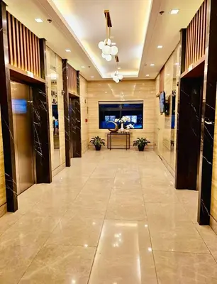 a hallway of a building with a table in the middle at The Destination in Manila