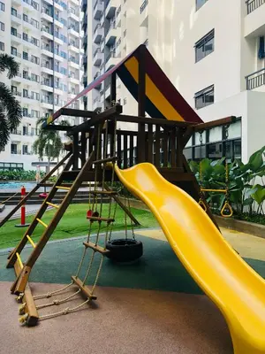 a playground with a slide and a slideintend at The Destination in Manila
