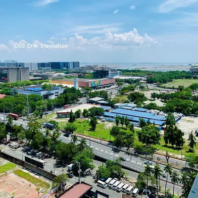 an aerial view of a city with buildings and cars at CGS Crib staycation in Manila