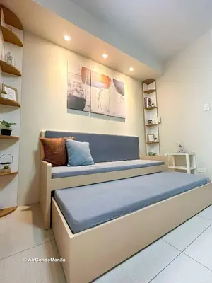 a bedroom with a large bed in a room at 1442 Air Condo Signature Stay Modern 1BR w Balcony in Manila