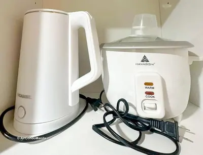 a counter with a mixer and a pair of scissors at 1442 Air Condo Signature Stay Modern 1BR w Balcony in Manila