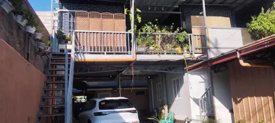 a car parked in an alley with a balcony at 6 Guest - Unit 5 Studio type with balcony in Santa Rosa