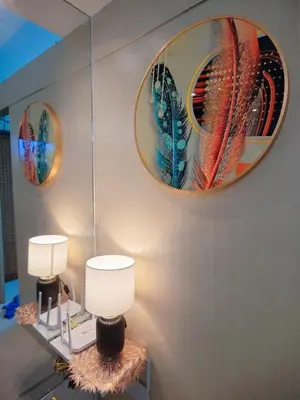a room with two lamps and two mirrors on the wall at Staycationsite at Sea Residences in Manila