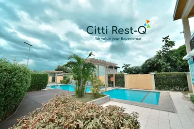 a villa with a swimming pool in a resort at Stylish Condo with Free Wifi & Netflix, Near Airport HMS3 in Manila