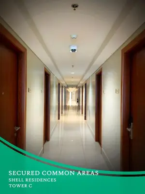 a hallway in a building with a long corridor at GV Holiday Homes - Shell Residences MOA - Cozy 1BR Apartment in Manila