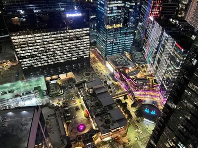 an aerial view of a city at night at Executive 5BR Penthouse Suite in Uptown BGC in Manila