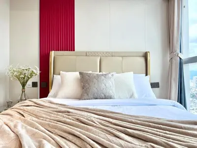 a bedroom with a large bed with a large window at Executive 5BR Penthouse Suite in Uptown BGC in Manila