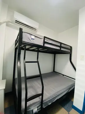 a bunk bed room with two bunk beds in it at Torre De Manila taft Tan38 in Manila