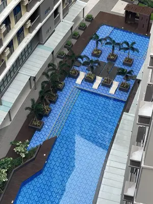 an overhead view of a pool in a building at 1BR with Queen Bed and Balcony, Walk to Okada in Manila