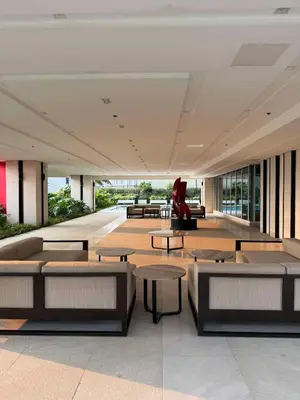 a lobby with couches and tables in a building at Casa Aotea in Sampong