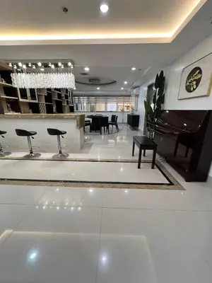 a lobby with a piano and a table and chairs at R&R Empire Rental Unit in Manila