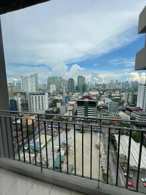 a view of the city from a balcony at Makati City Antel Spa Residences 2306 in Manila
