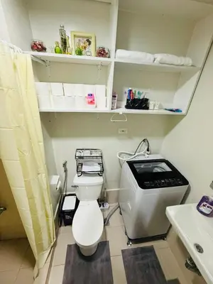 a small bathroom with a toilet and a sink at Modern japan home in the Philippines in Manila