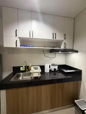 a kitchen with a sink and a counter top at Modern japan home in the Philippines in Manila