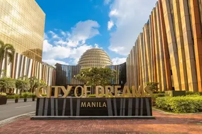 a sign in front of a large building at Sy bay in Manila