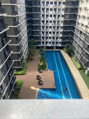 an overhead view of a swimming pool in a apartment building at Casa Cion Staycation in Manila