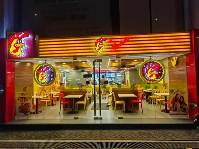 a restaurant with tables and chairs in front of it at 1BR Condotel at Azure Urban Resort Near Airport #AZ07 in Manila