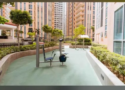 a park with two exercise equipment in a city at Venice Luxe Stay, Studio Type, King Bed, 65 TV-Netflix 40\u5e73\u65b9\u56db\u4eba\u516c\u5bd3 \u53a8\u5177\u9f50\u5168 in Manila