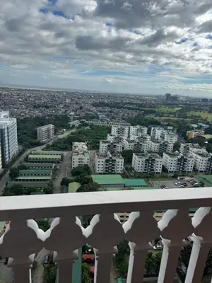 a view of a city from the balcony of a building at Venice Luxe Stay, Studio Type, King Bed, 65 TV-Netflix 40\u5e73\u65b9\u56db\u4eba\u516c\u5bd3 \u53a8\u5177\u9f50\u5168 in Manila