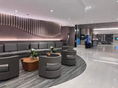 a lobby with couches and tables in a building at Mango Room near MOA STARCITY 2 Beds in Manila